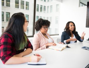 Women in a boardroom having a discussion